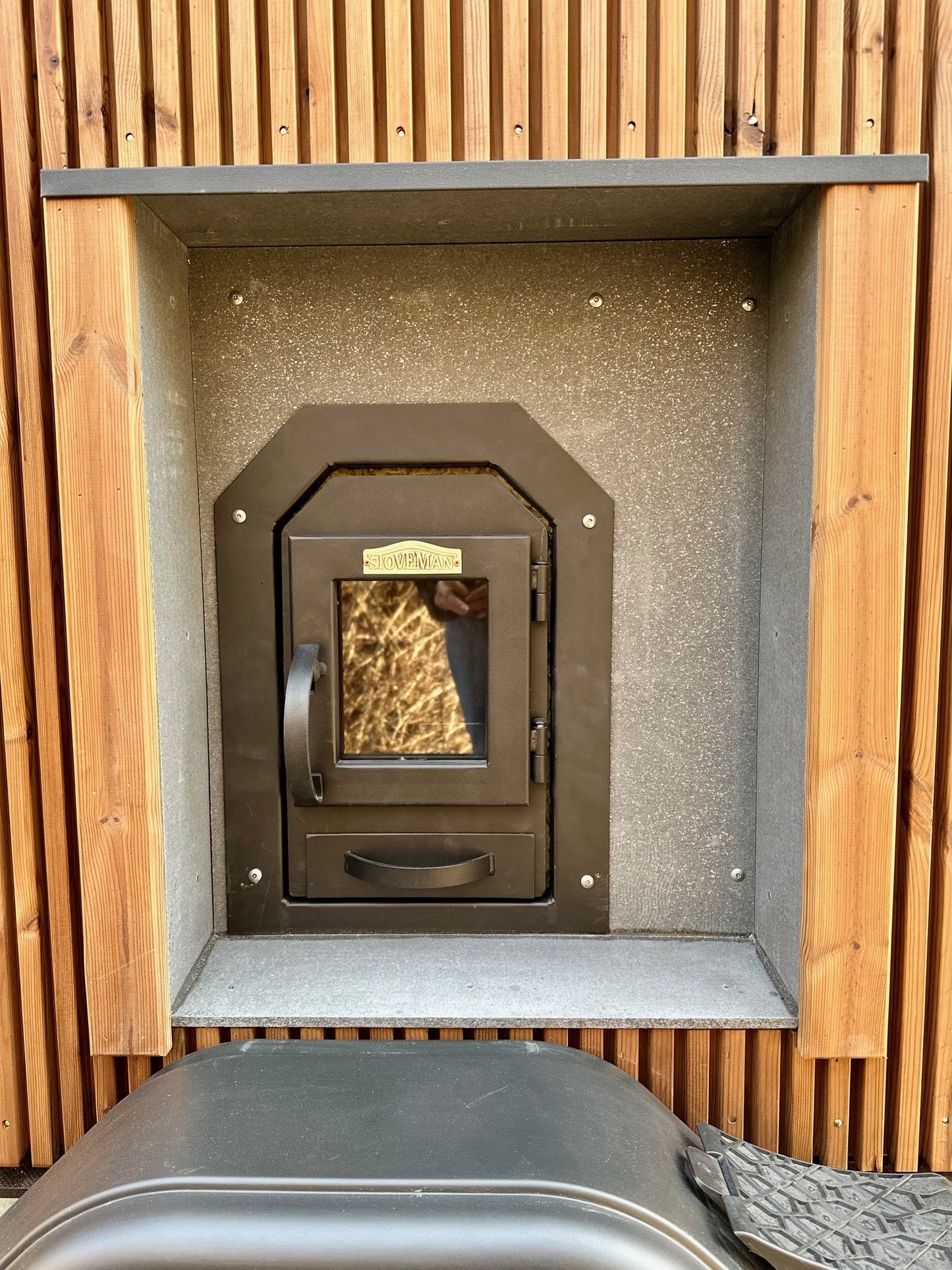The Nomad mobile sauna with the sauna room glass door open
