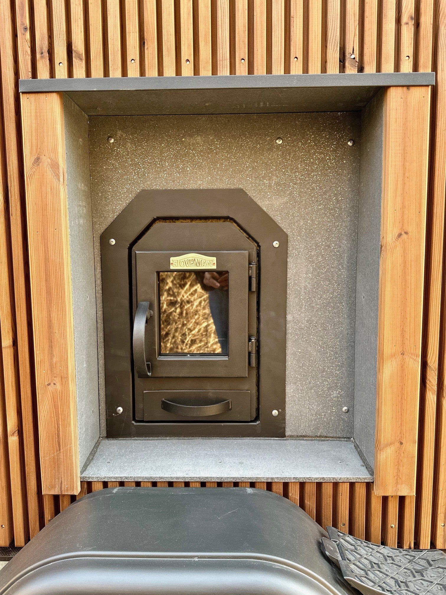The Nomad mobile sauna with the sauna room glass door open