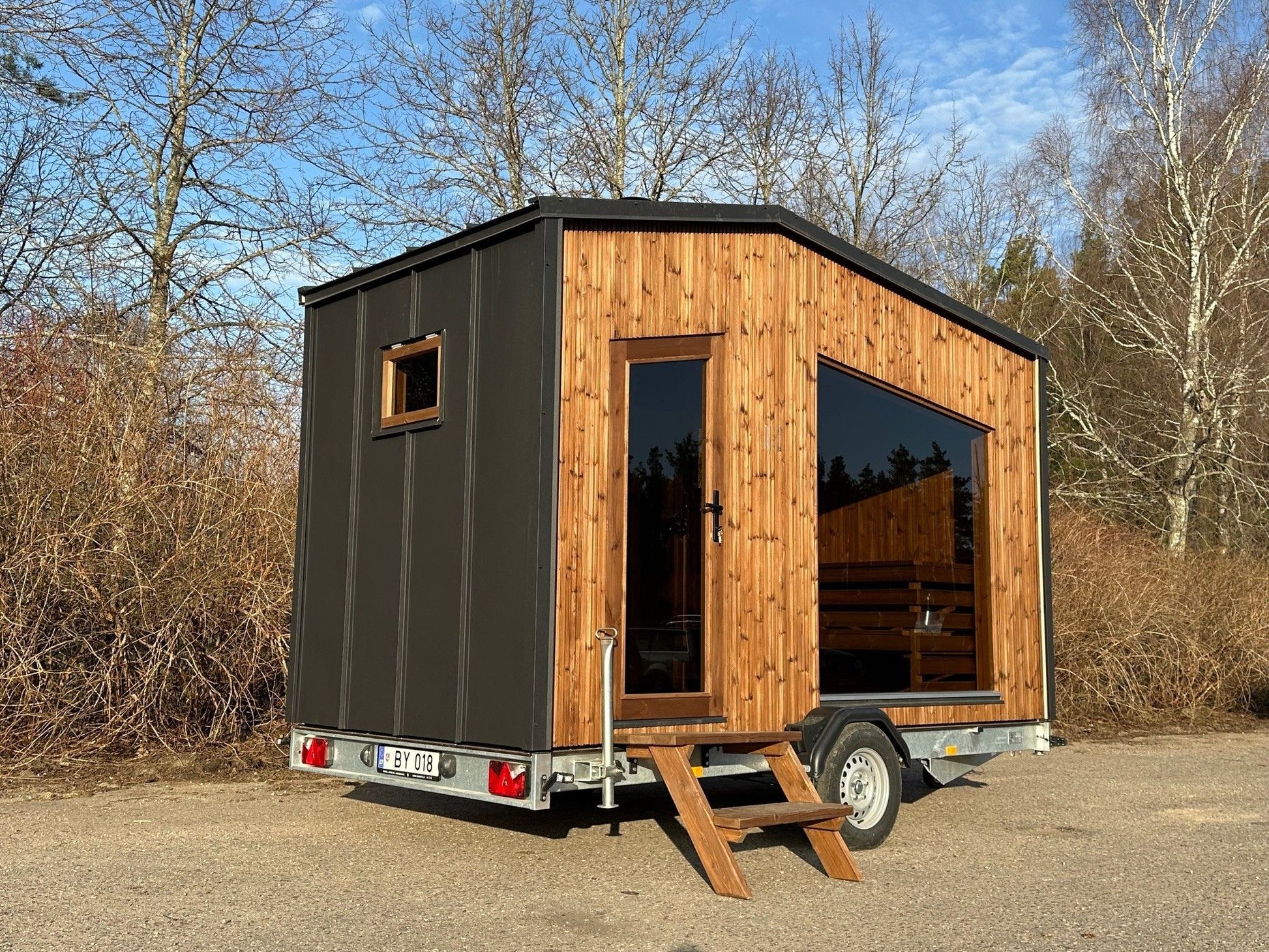 The Nomad mobile sauna with its rear chimney and tinted window