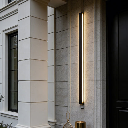 Modern outdoor lighting fixture on a building exterior with decorative elements.