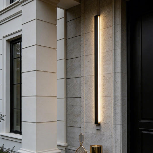 Modern outdoor lighting fixture on a building exterior with decorative elements.