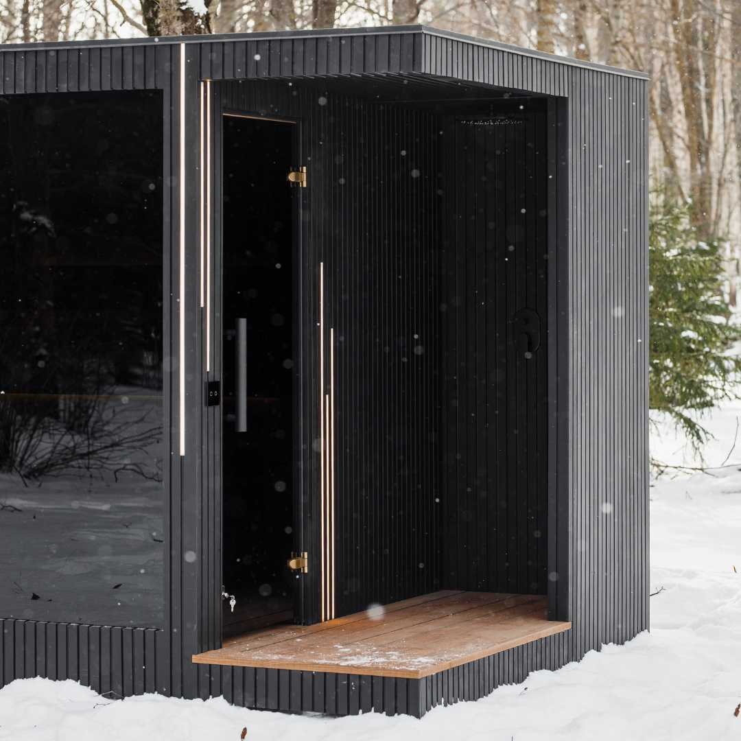 EBON sauna shower area detail with black fittings and drainage