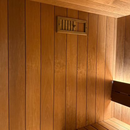EBON outdoor sauna shown from the side in a garden setting