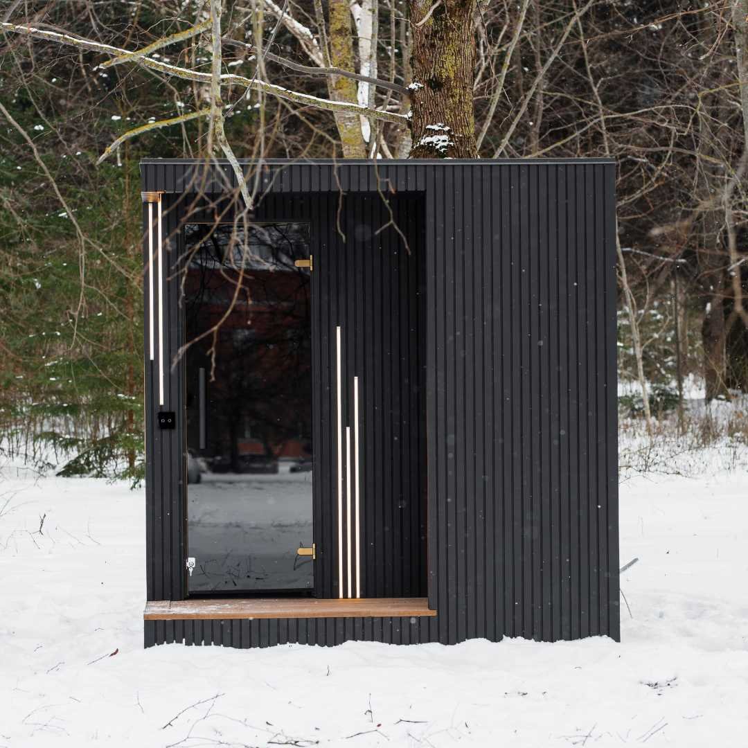 EBON sauna interior in thermo black alder with thermo pine benches