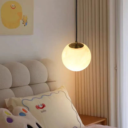Brass and alabaster sphere wall light bedroom