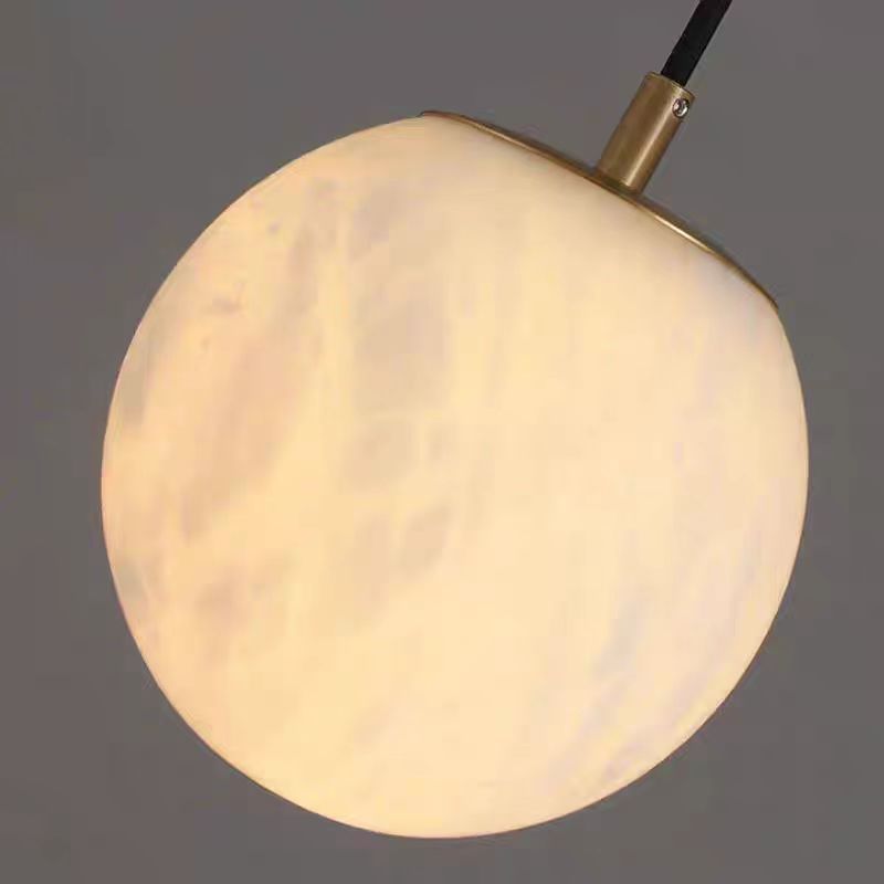 Alabaster ball wall light warm ambient glow