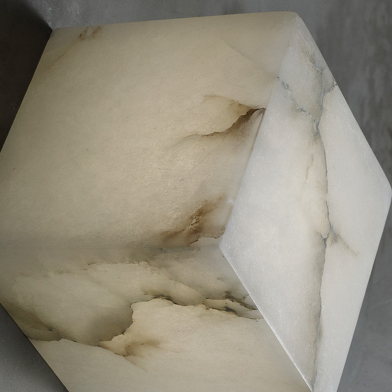 Alabaster cube wall light lit natural veining