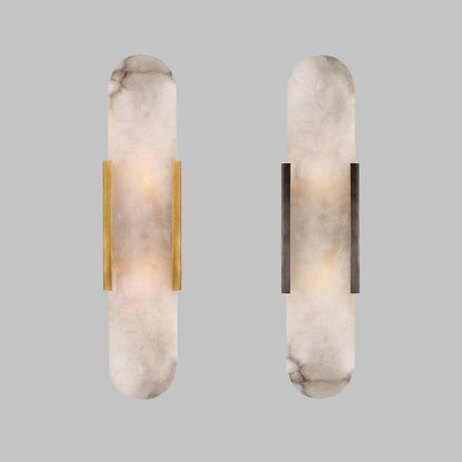 Natural alabaster block wall light warm brass frame glowing warm white