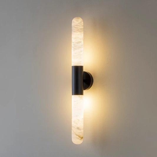 Natural alabaster cylindrical wall light brass frame warm glow