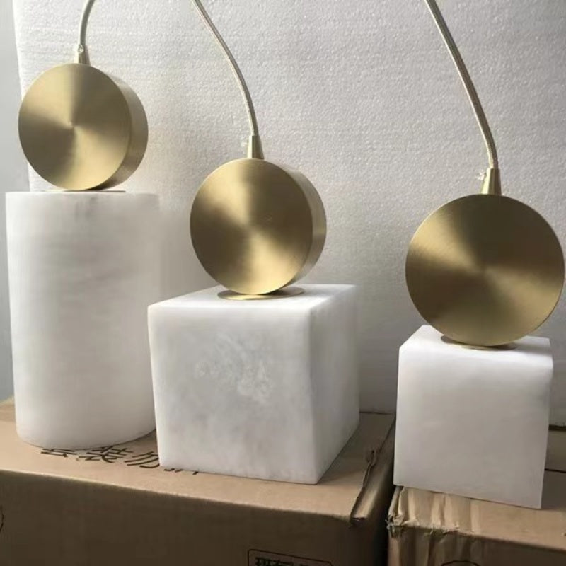 Brushed gold pendant fittings with illuminated stone-effect shades