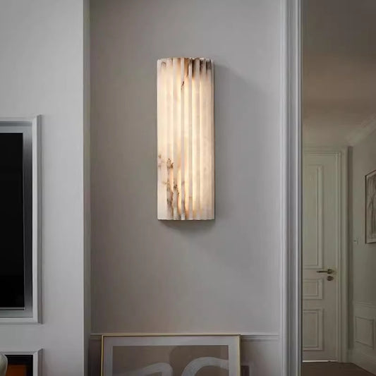 Spanish alabaster ribbed wall sconce in bedroom