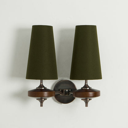 Double walnut and brass wall sconce with green linen shade