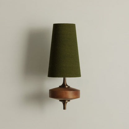Single walnut and brass wall sconce with green linen shade