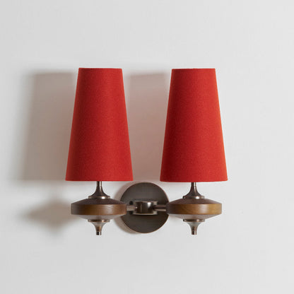 Double walnut and brass wall sconce with terracotta red linen shade