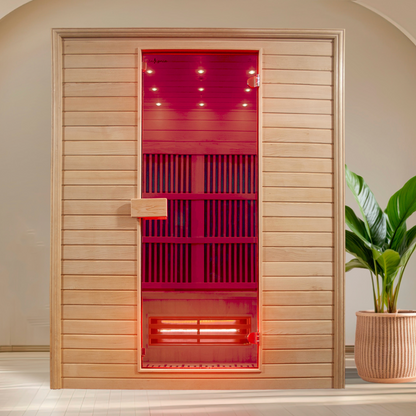Wooden sauna door with red interior light and a plant on the right side.