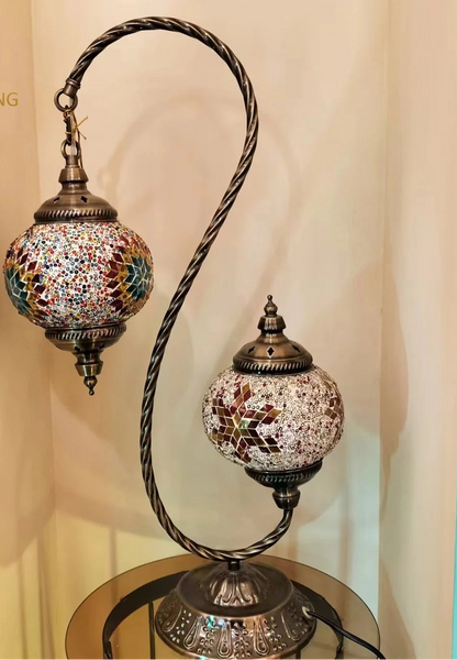 Turkish mosaic table lamp with two hanging glass shades on a twisted metal stand, in brown, green, blue and white mosaic glass