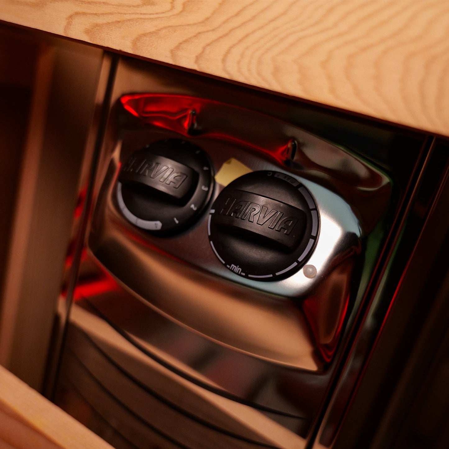 Harvia stainless steel sauna heater with Finnish sauna stones inside the barrel sauna