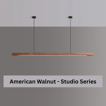 Walnut studio series pendant in minimalist Scandinavian dining room