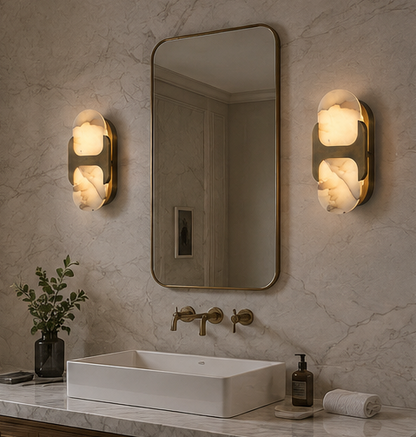 Ovale alabaster wall sconce lit on an interior wall, showing the warm glow through the natural stone