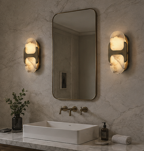 Ovale alabaster wall sconce lit on an interior wall, showing the warm glow through the natural stone
