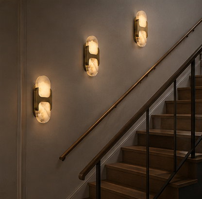 Copper and alabaster wall sconce shown in a modern interior with warm layered lighting