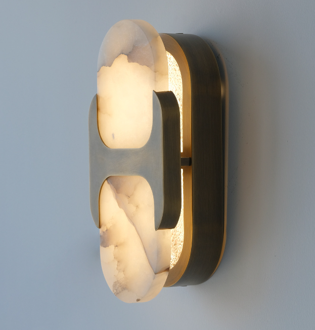 Natural alabaster oval wall light with a warm glow through the translucent stone