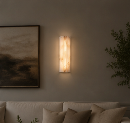 Puro alabaster wall sconce lighting a corridor wall