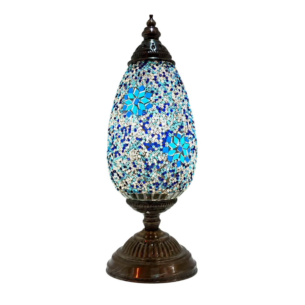 Serena Turkish mosaic table lamp with a blue and white glass shade on an antique bronze base, shown on a white background