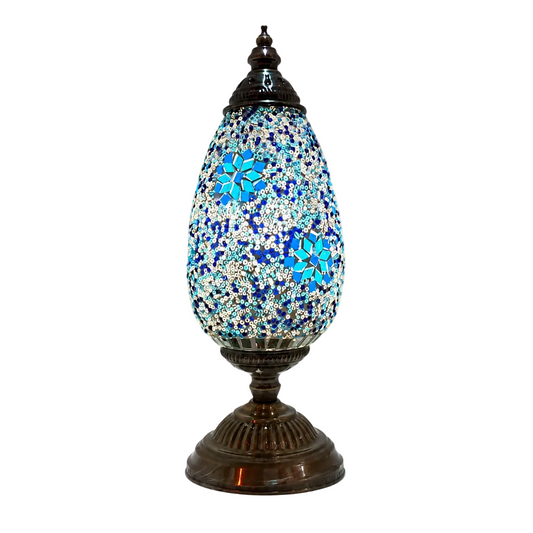 Serena Turkish mosaic table lamp with a blue and white glass shade on an antique bronze base, shown on a white background