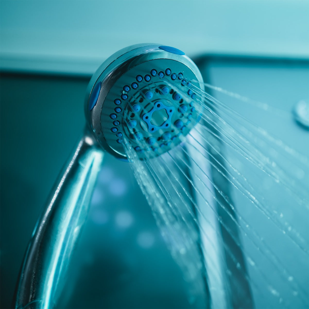 Twin hand showers on riser rails