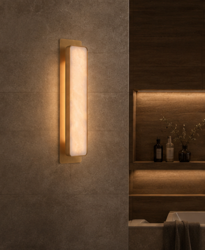 Torino copper and marble wall sconce shown mounted on a wall in a modern interior
