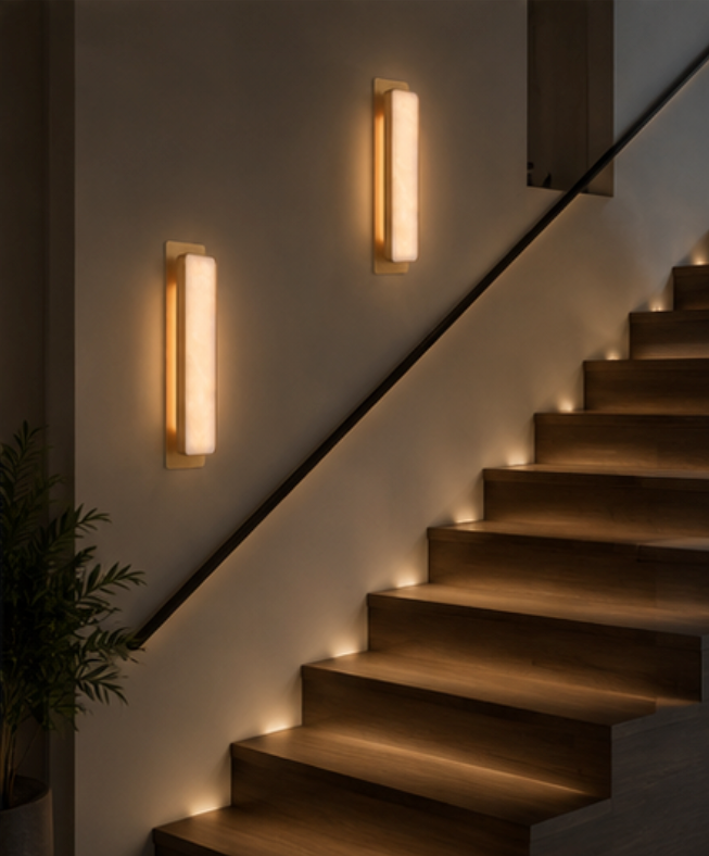 Torino wall sconce detail showing the copper frame fixing and cylindrical marble shade
